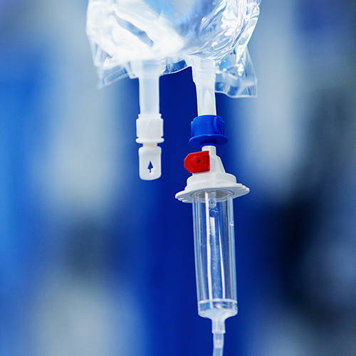 Hair Loss From Medical Treatment. A closeup of an IV dripline.