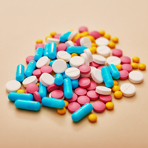 Hair Loss From Medication. A collection of various pills in different sizes, shapes, and colors.